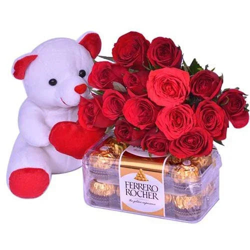 White teddy bear holding red roses with a box of Ferrero Rocher chocolates on a white background
