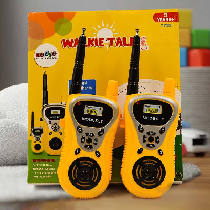 Yellow walkie-talkies with packaging featuring the brand 'Googo' on a neutral background.