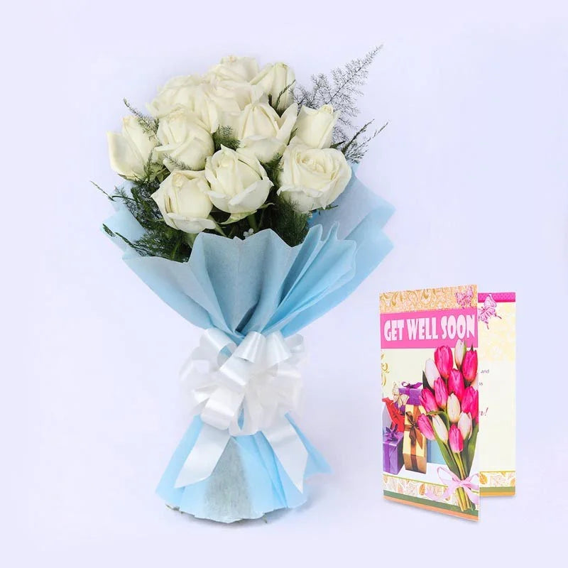 Bouquet of white roses with light blue wrap and a 'Get Well Soon' card on a light gray background