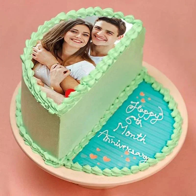 Anniversary cake with a photo of a couple and 'Happy 6th Month Anniversary' text on a pink background