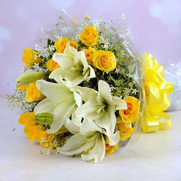 Bouquet of yellow roses and white lilies with a yellow statue on a light background
