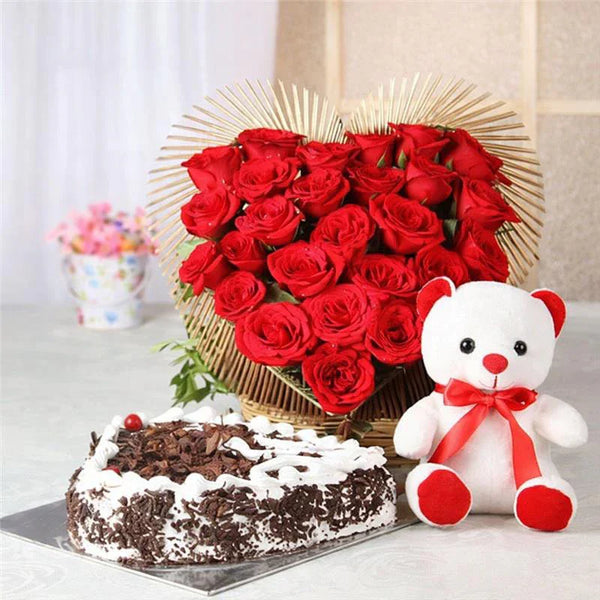 Heart-shaped red rose bouquet with white teddy bear and chocolate cake, perfect for gifting
