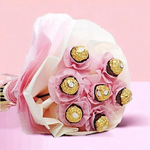 Bouquet of Ferrero Rocher chocolates wrapped in pink and white paper, gift idea