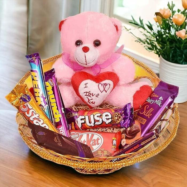 Gift basket with pink teddy bear, assorted chocolates, perfect for special occasions