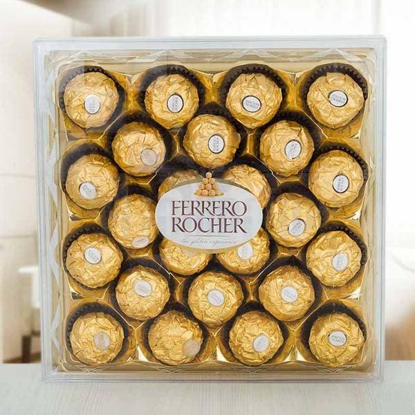 Box of Ferrero Rocher chocolates with a clear lid