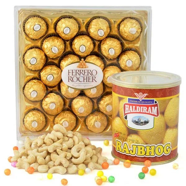 Box of Ferrero Rocher chocolates, a can of Haldiram Rajbhog, and cashews on a white background