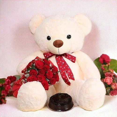 Plush teddy bear with red bow, holding red rose bouquet and chocolate cake, gift arrangement