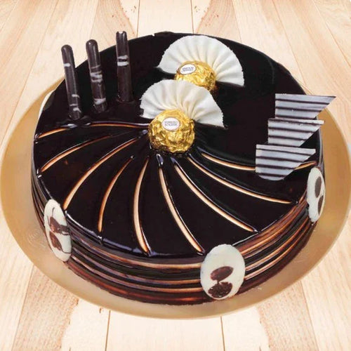 Chocolate cake with decorative elements on a wooden surface