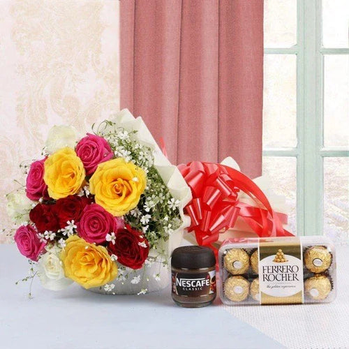 Bouquet of flowers, Nescafe Coffee Powder, and Ferrero Rocher on a table with a pink curtain in the background