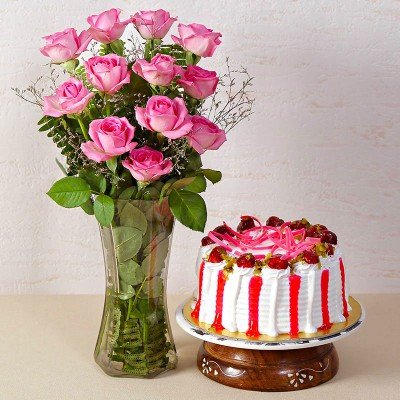 Strawberry Cake With Dozen Pink Roses In A Glass Vase